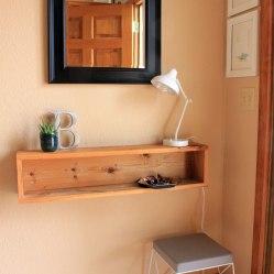 Add a box style shelf to an entry: https://ourhumbleabodeblog.com/2013/11/14/console-ation-prize/